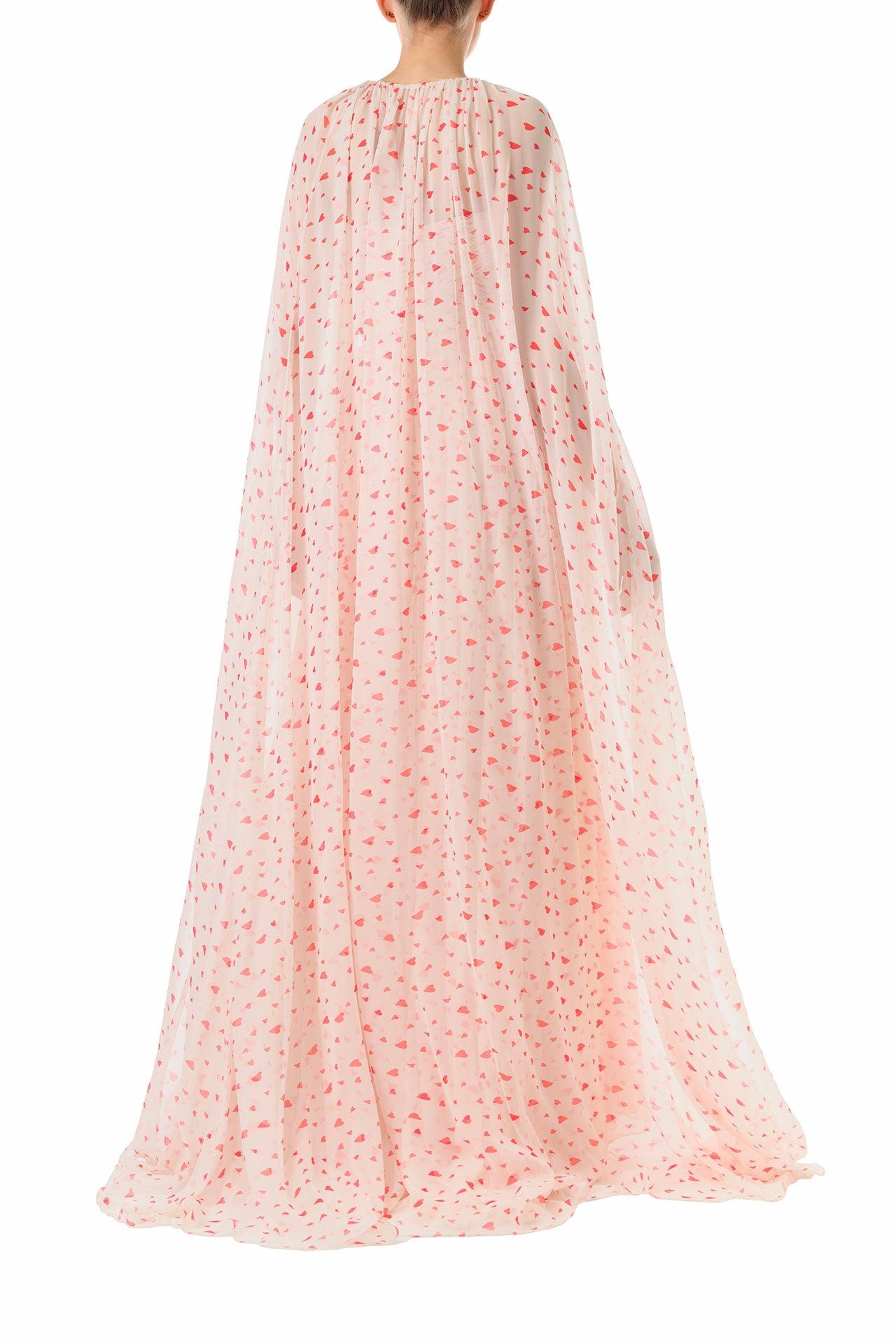 Monique Lhuillier Fall 2024 chiffon cape shown over the matching strapless gown with gathered sweetheart bodice in heart printed chiffon fabric - back.