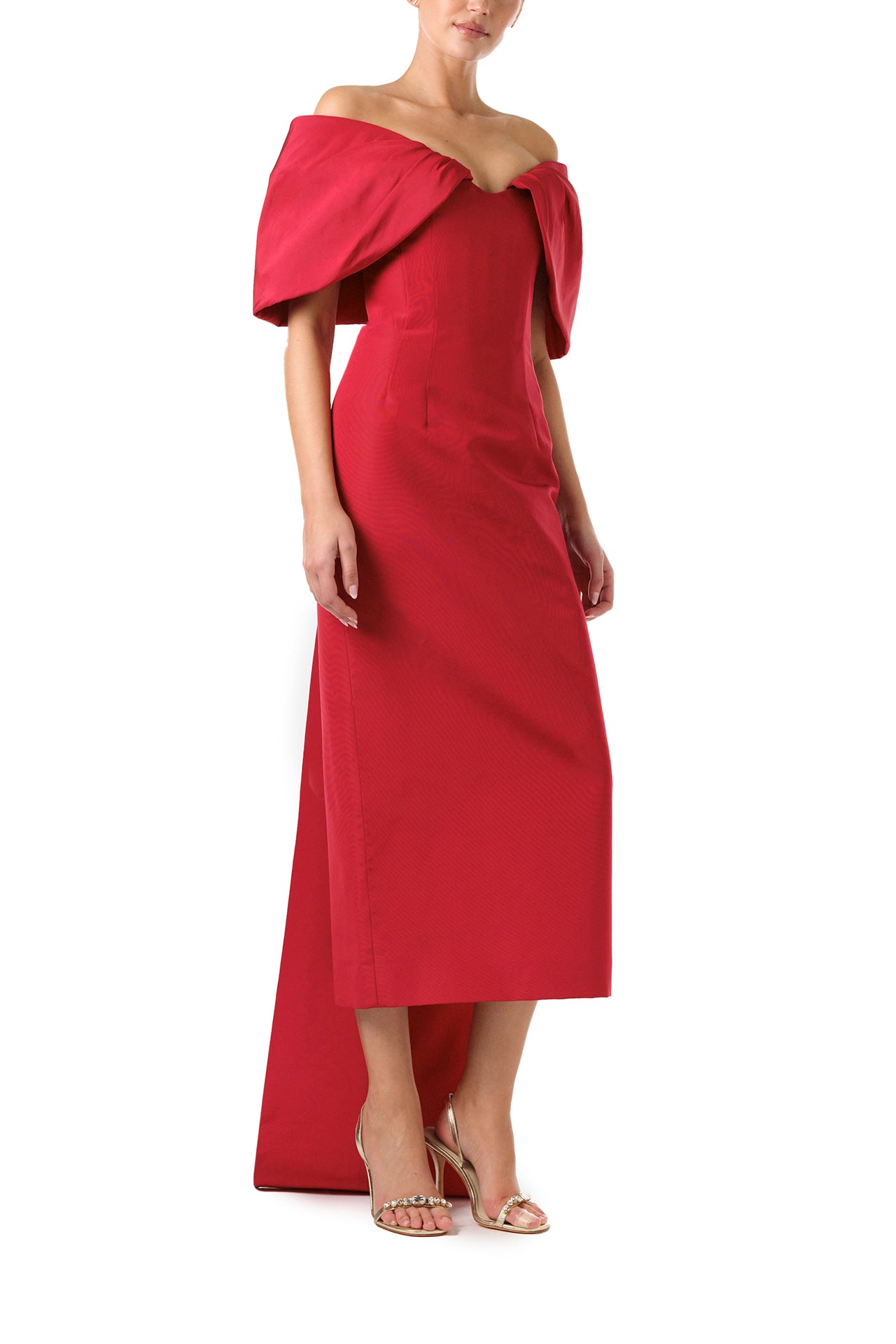 Monique Lhuillier Fall 2024 off-the-shoulder tea length column dress with draped neckline and bow-train in pomegranate silk faille - side.