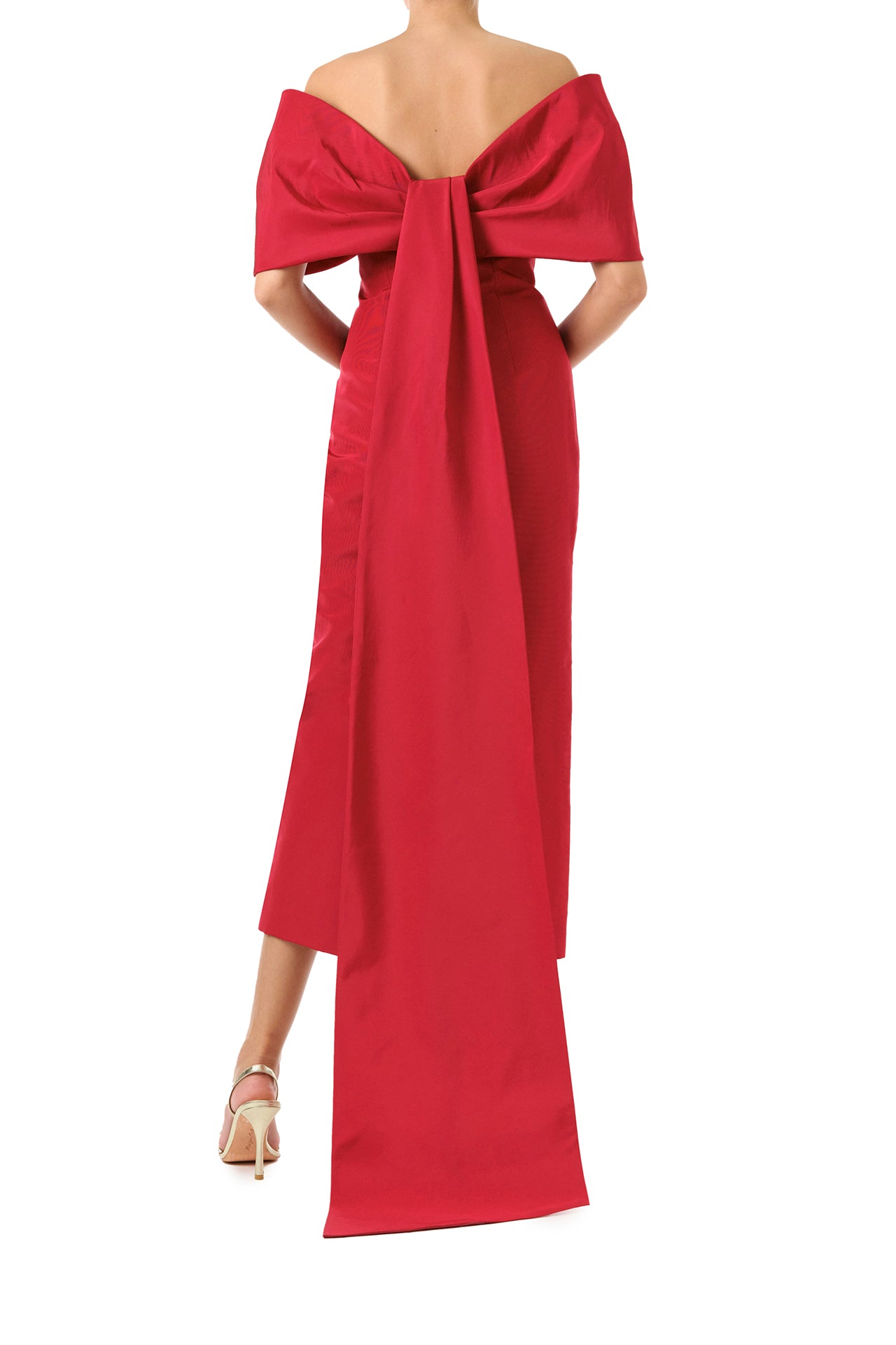 Monique Lhuillier Fall 2024 off-the-shoulder tea length column dress with draped neckline and bow-train in pomegranate silk faille - back.