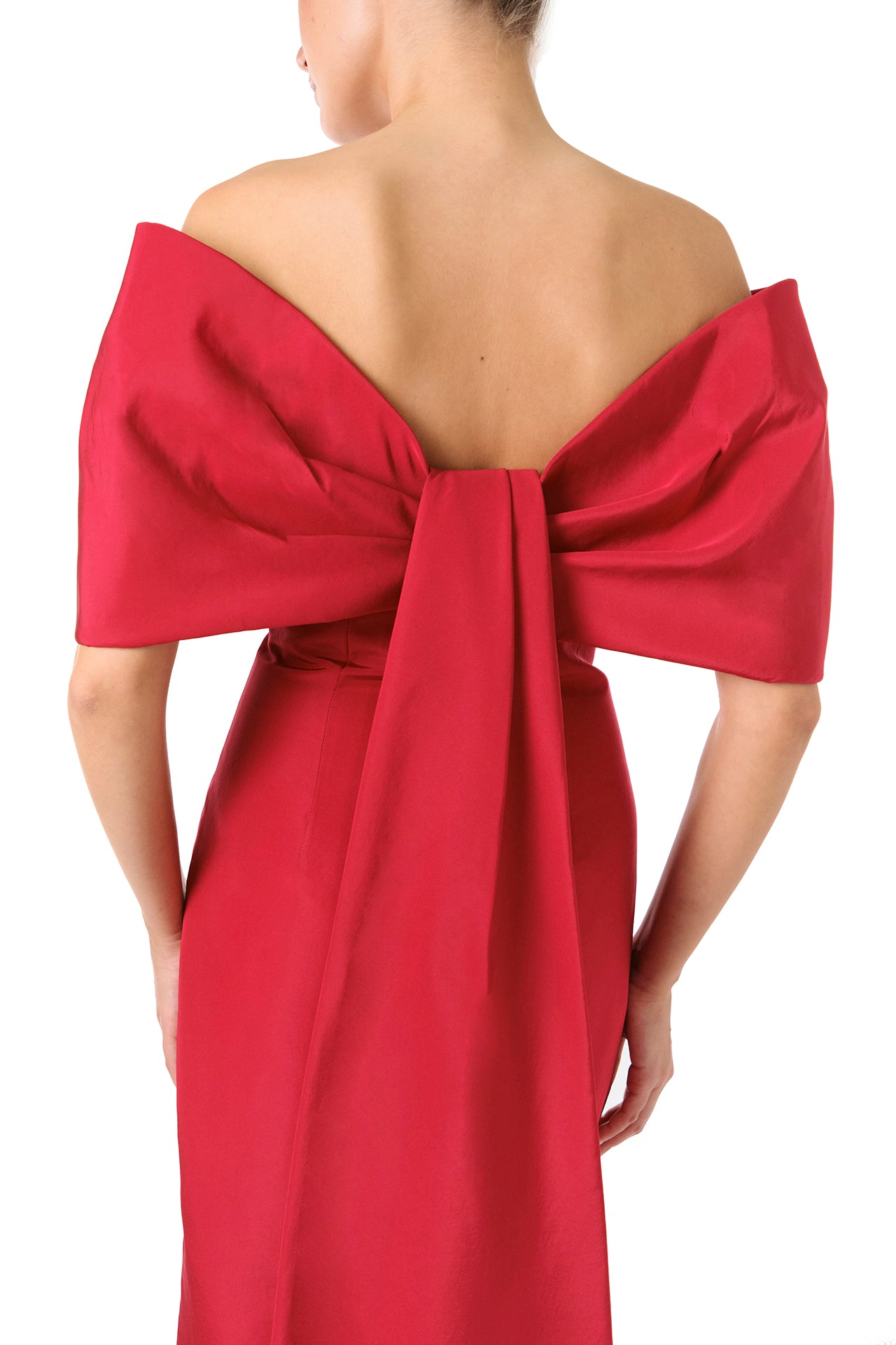 Monique Lhuillier Fall 2024 off-the-shoulder tea length column dress with draped neckline and bow-train in pomegranate silk faille - bow detail.