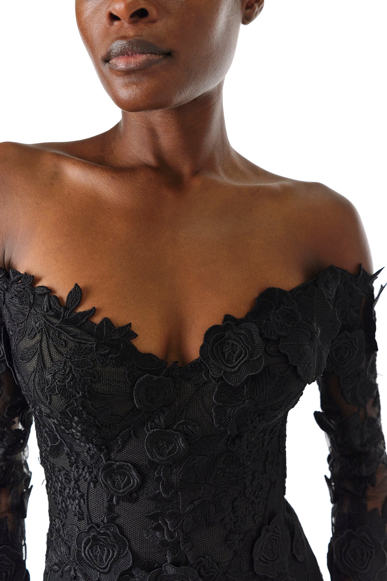 Monique Lhuillier Fall 2024 Long sleeve black lace trumpet gown with off-the-shoulder sweetheart neckline and unlined sleeves - neckline.