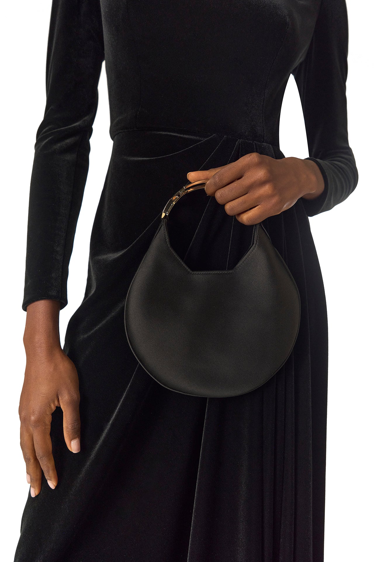 Monique Lhuillier Fall 2024 long sleeve gown with square neckline, front skirt draping and detached neck scarf in noir stretch velour - waistline with Demi bag.