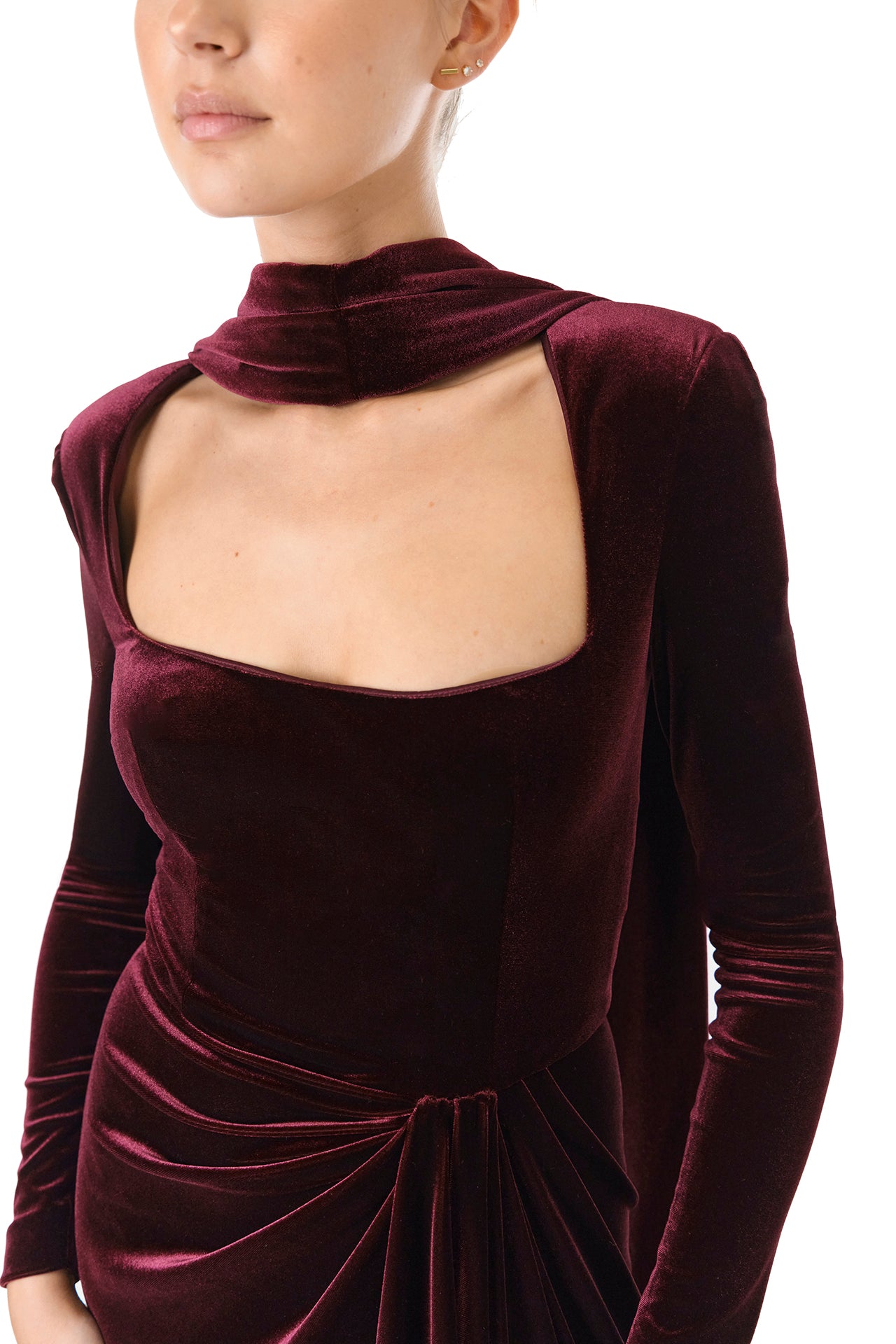 Monique Lhuillier Fall 2024 Long sleeve gown with square neckline, front skirt draping and detached neck scarf in Merlot colored stretch velour - neckline detail.