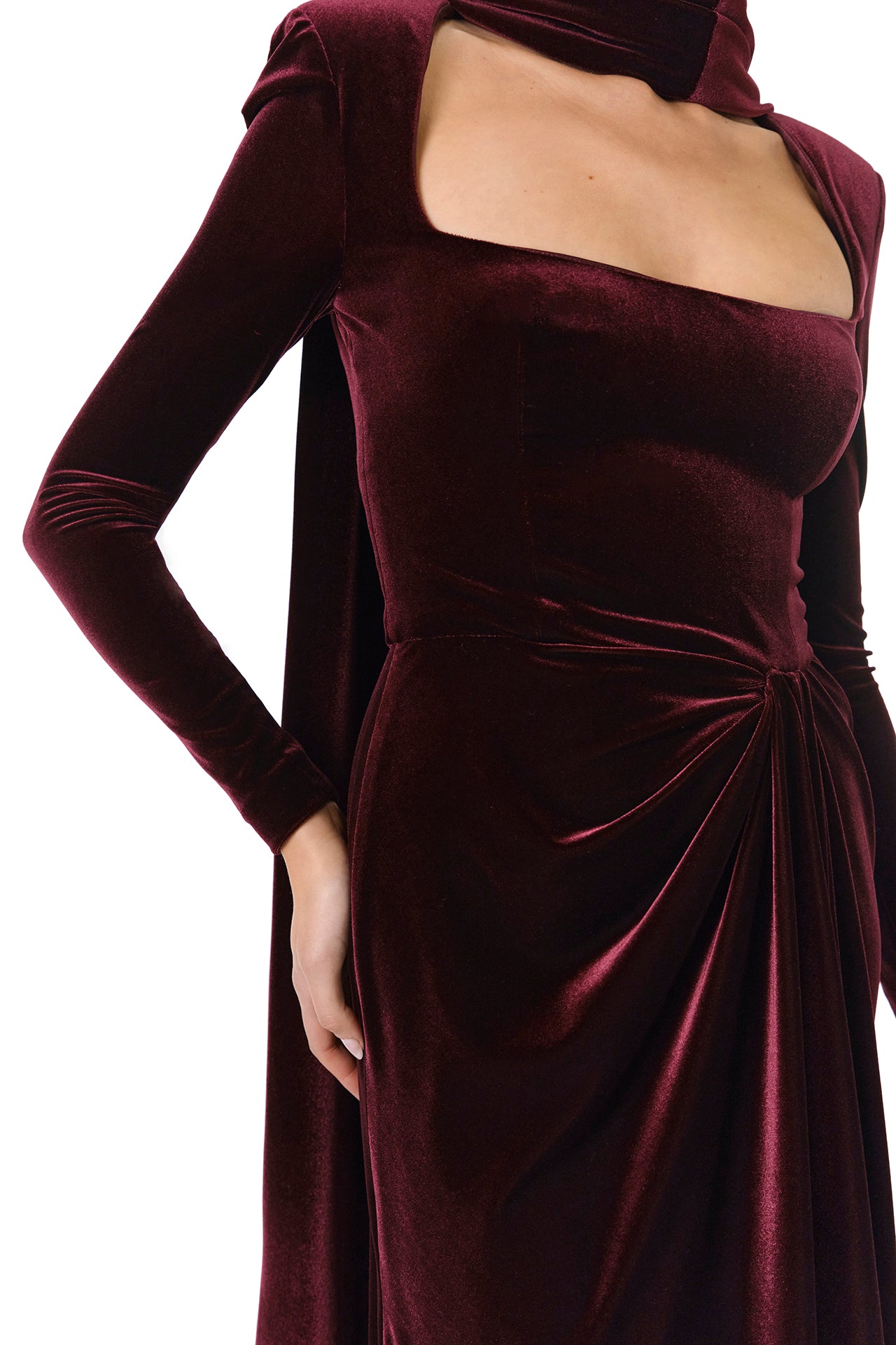 Monique Lhuillier Fall 2024 Long sleeve gown with square neckline, front skirt draping and detached neck scarf in Merlot colored stretch velour - fabric detail.