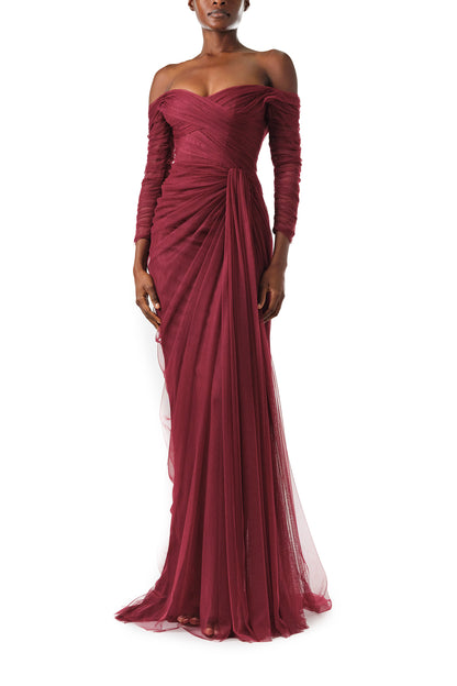 Monique Lhuillier Fall 2024 Off the shoulder draped tulle gown with low V-back, long sleeves and corseted bodice in Merlot - front.