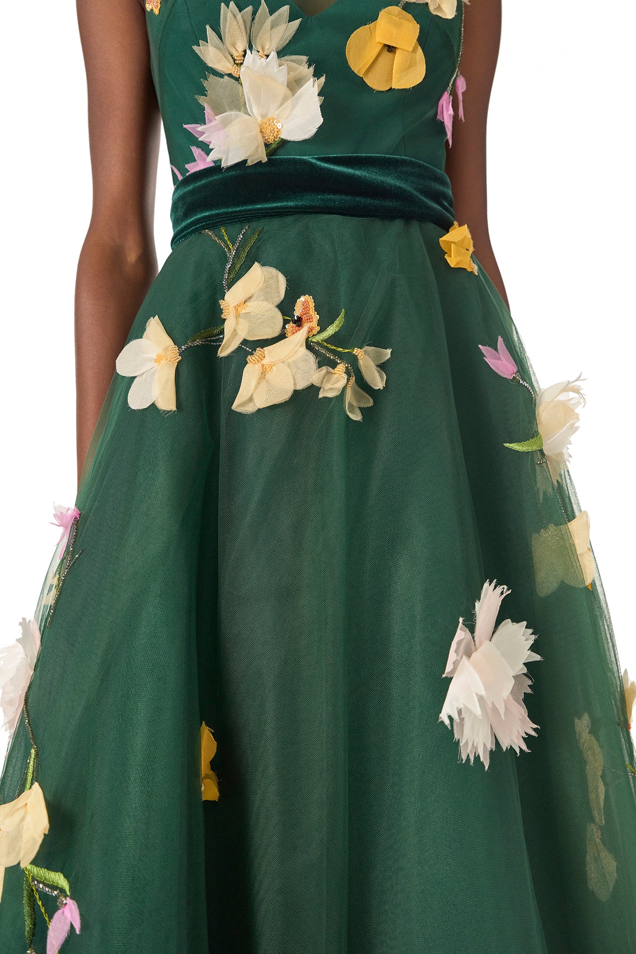 Monique Lhuillier Fall 2024 sleeveless, green tulle gown with floral embroidery, illusion neckline, full A-line skirt and velvet cummerbund at waist - skirt.
