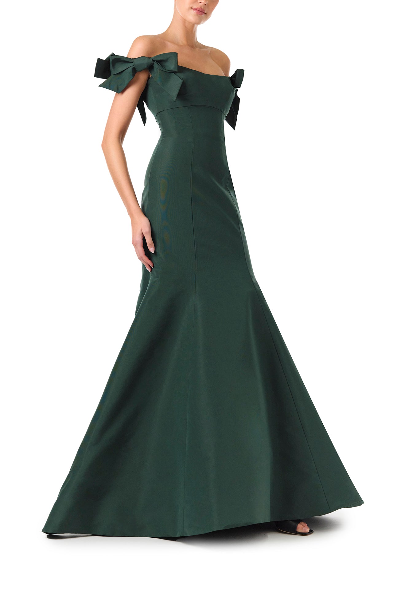 Monique Lhuillier Fall 2024 off the shoulder gown with trumpet skirt and bow sleeves in Juniper green faille fabric - right side.
