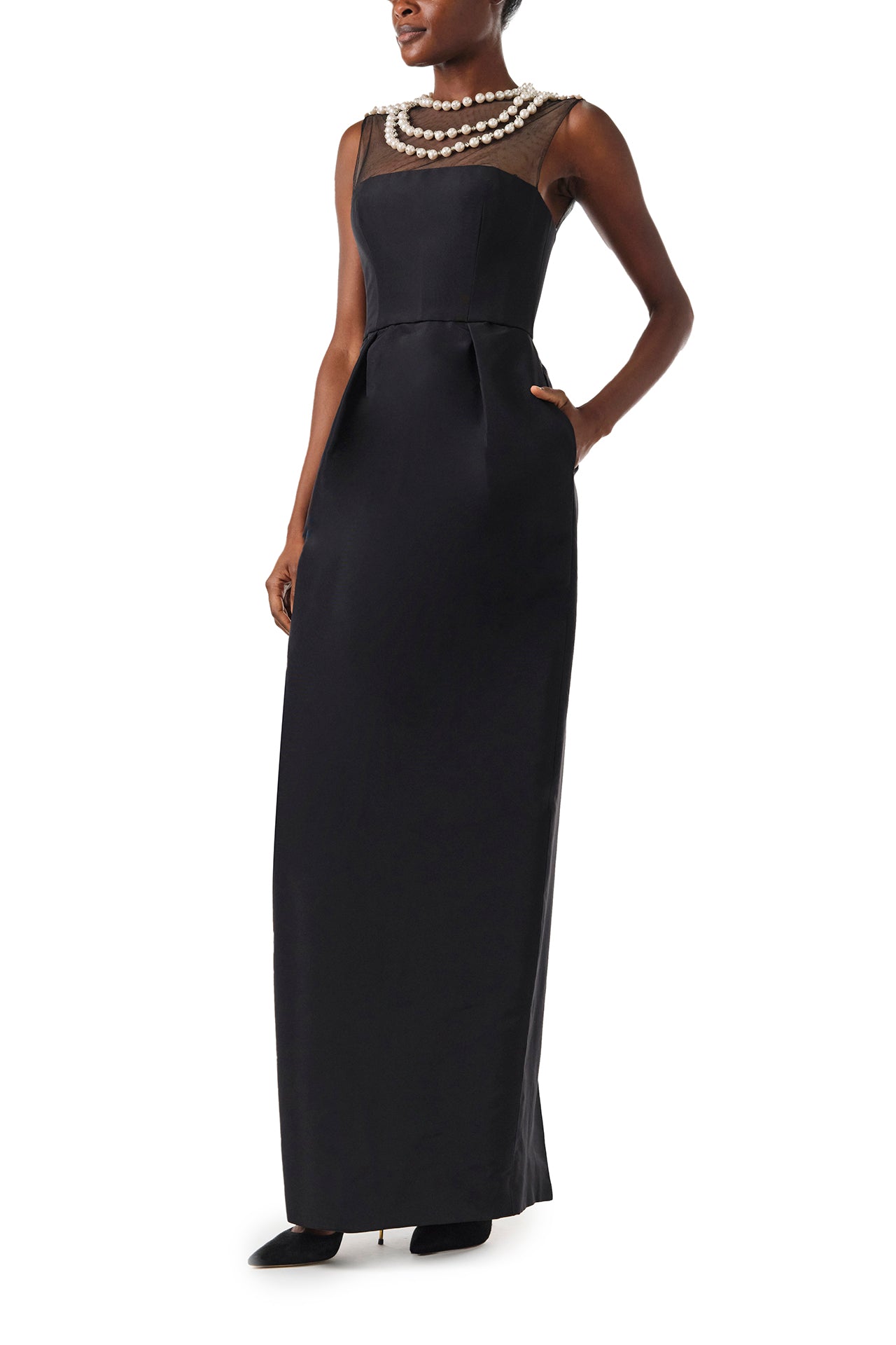 Monique Lhuillier Fall 2024 sleeveless, illusion neckline column gown in noir faille fabric with pearl embroidery and pockets - pockets.