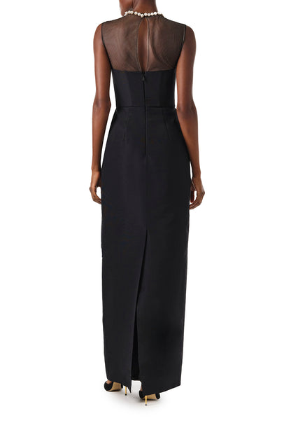 Monique Lhuillier Fall 2024 sleeveless, illusion neckline column gown in noir faille fabric with pearl embroidery and pockets - video.