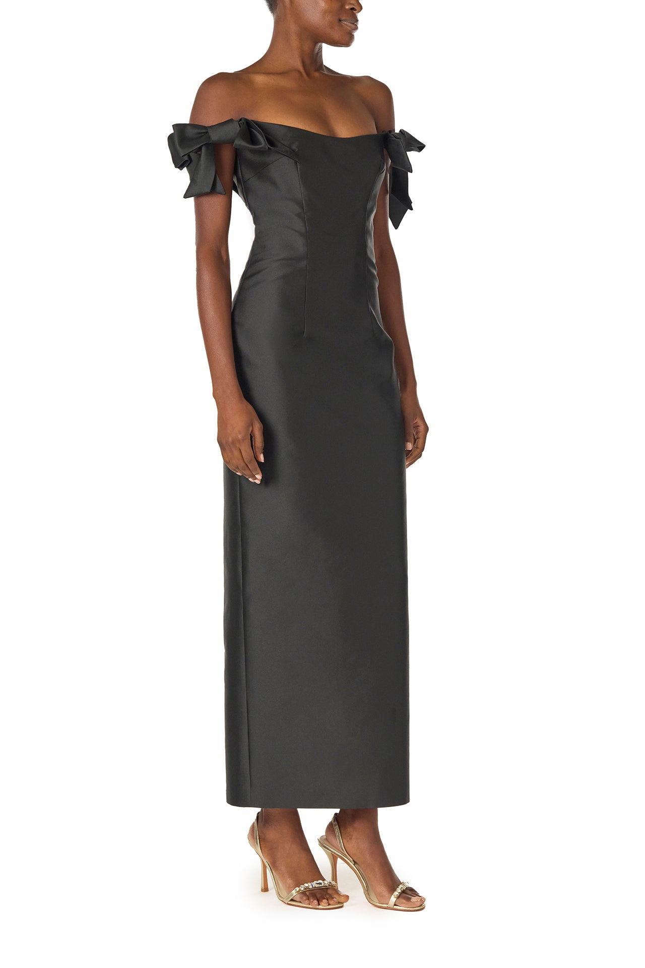 Monique Lhuillier Fall 2024 off the shoulder sheath dress with bow sleeves in Noir mikado - side.