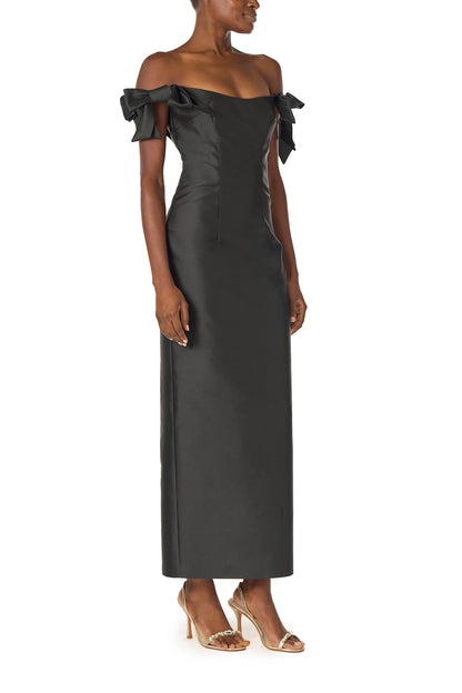 Monique Lhuillier Fall 2024 off the shoulder sheath dress with bow sleeves in Noir mikado - side.