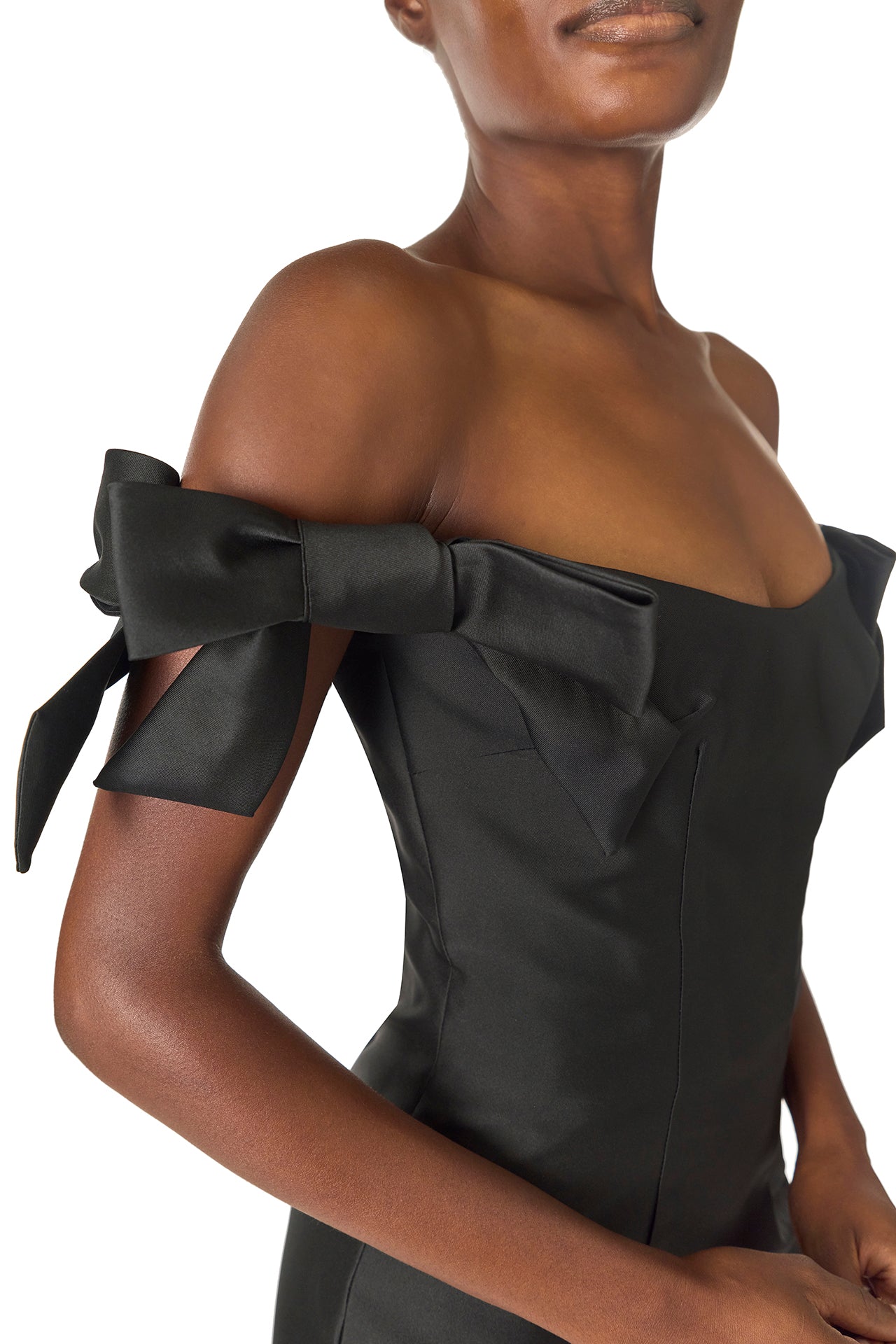 Monique Lhuillier Fall 2024 off the shoulder sheath dress with bow sleeves in Noir mikado - bow detail.
