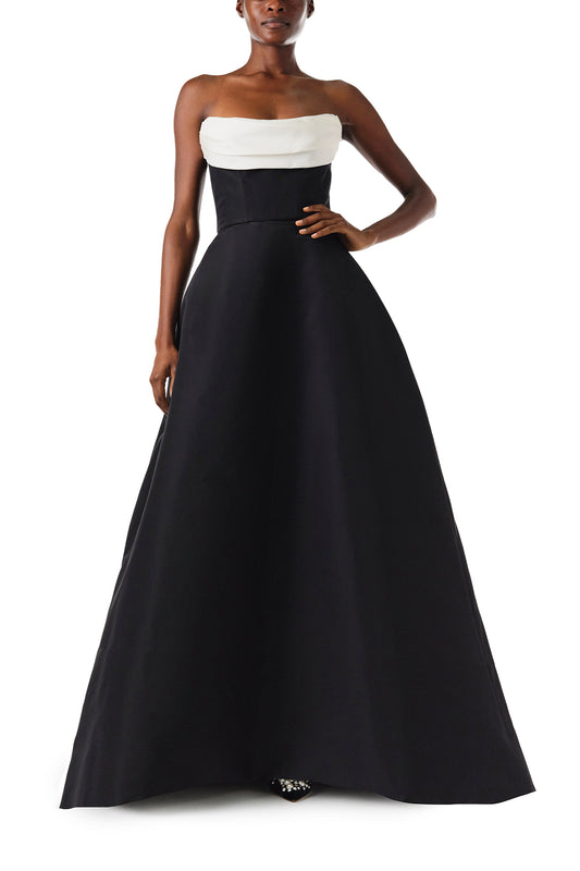 Monique Lhuillier Fall 2024 strapless ball gown with front-draped, contrasting neckline in noir/silk white faille fabric - front.