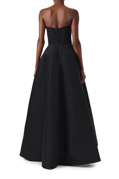 Monique Lhuillier Fall 2024 strapless ball gown with front-draped, contrasting neckline in noir/silk white faille fabric - back.