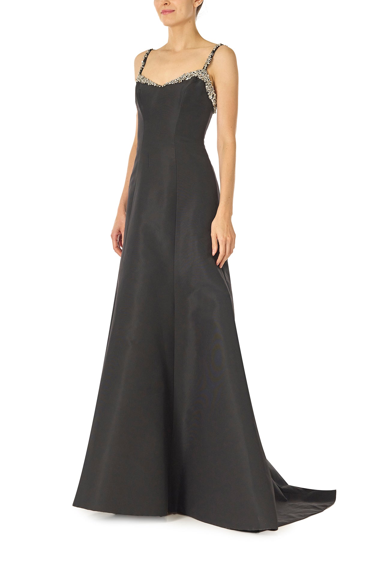 Monique Lhuillier Spring 2025 Modified trumpet gown with crystal beaded neckline and spaghetti straps in Noir Silk Faille - left side.