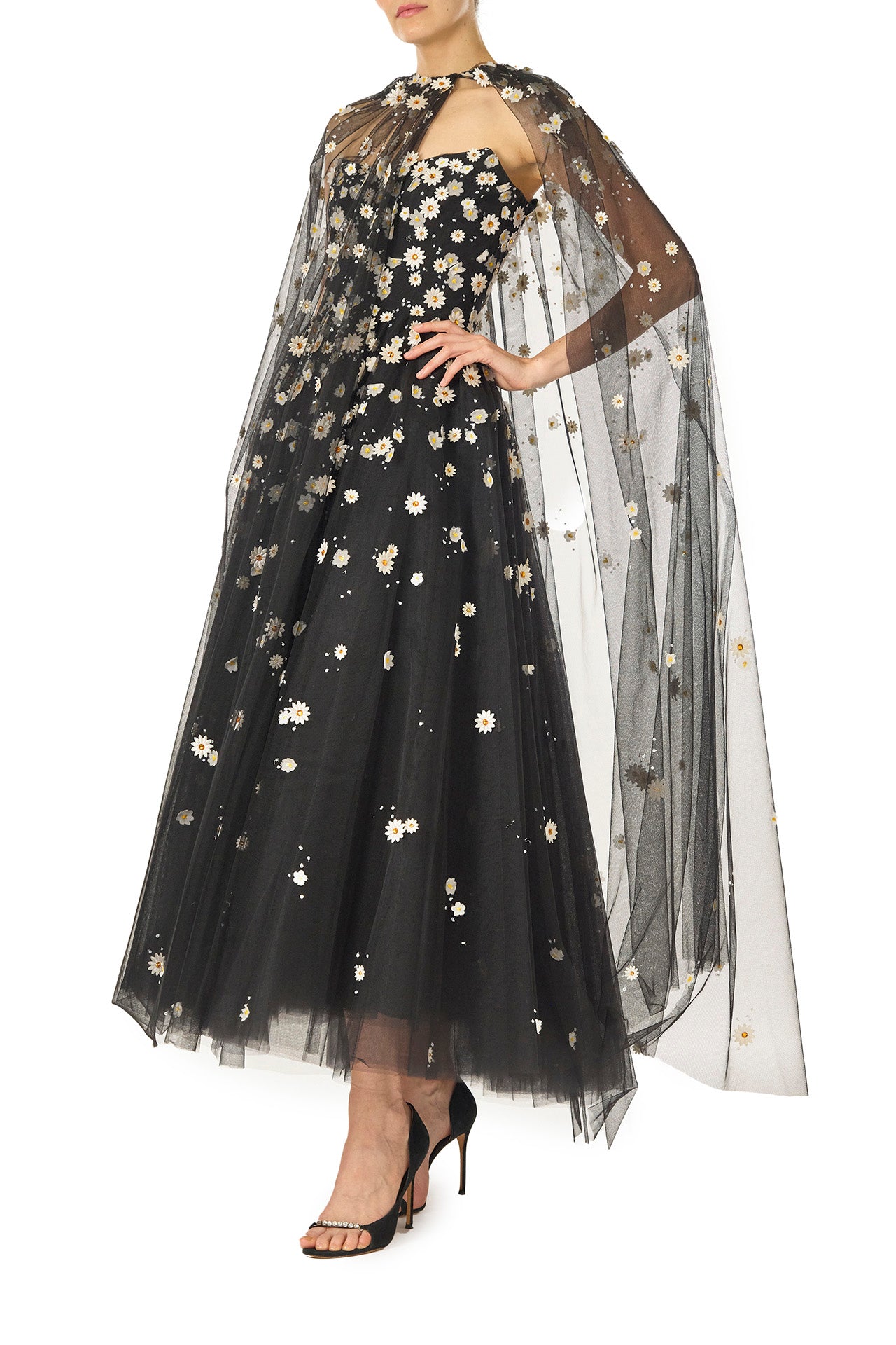 Monique Lhuillier Spring 2025 Noir tulle cape with Daisy embroidery and hook and eye closure at front of neckline - side.