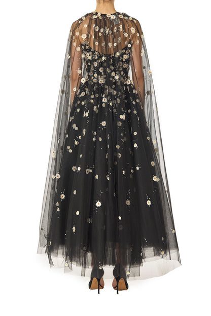 Monique Lhuillier Spring 2025 Noir tulle cape with Daisy embroidery and hook and eye closure at front of neckline - back.