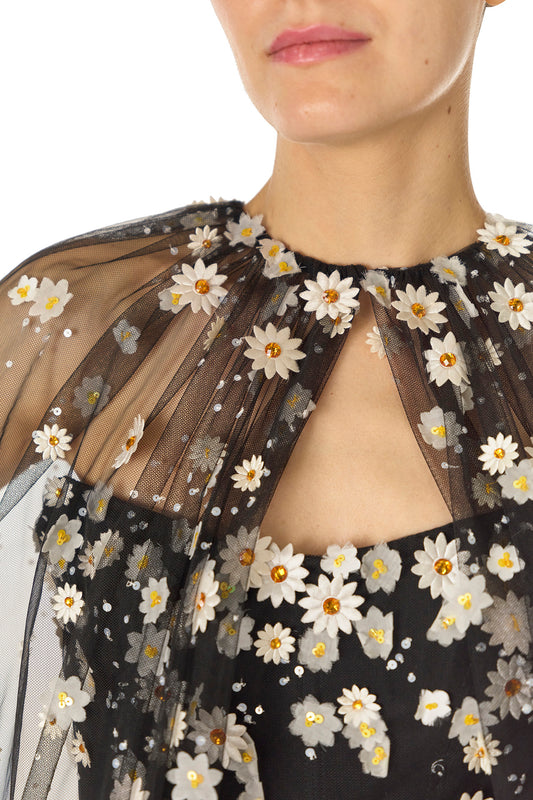 Monique Lhuillier Spring 2025 Noir tulle cape with Daisy embroidery and hook and eye closure at front of neckline - neckline.