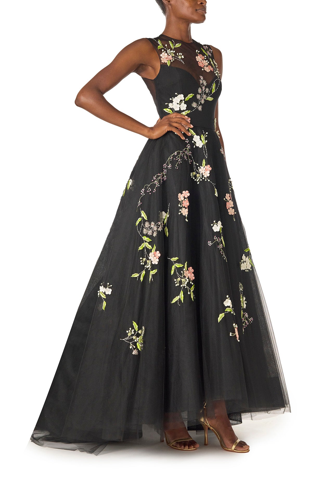 Monique Lhuillier Spring 2025 Sleeveless, noir tulle gown with floral embroidery and slight high-low hem - right side.