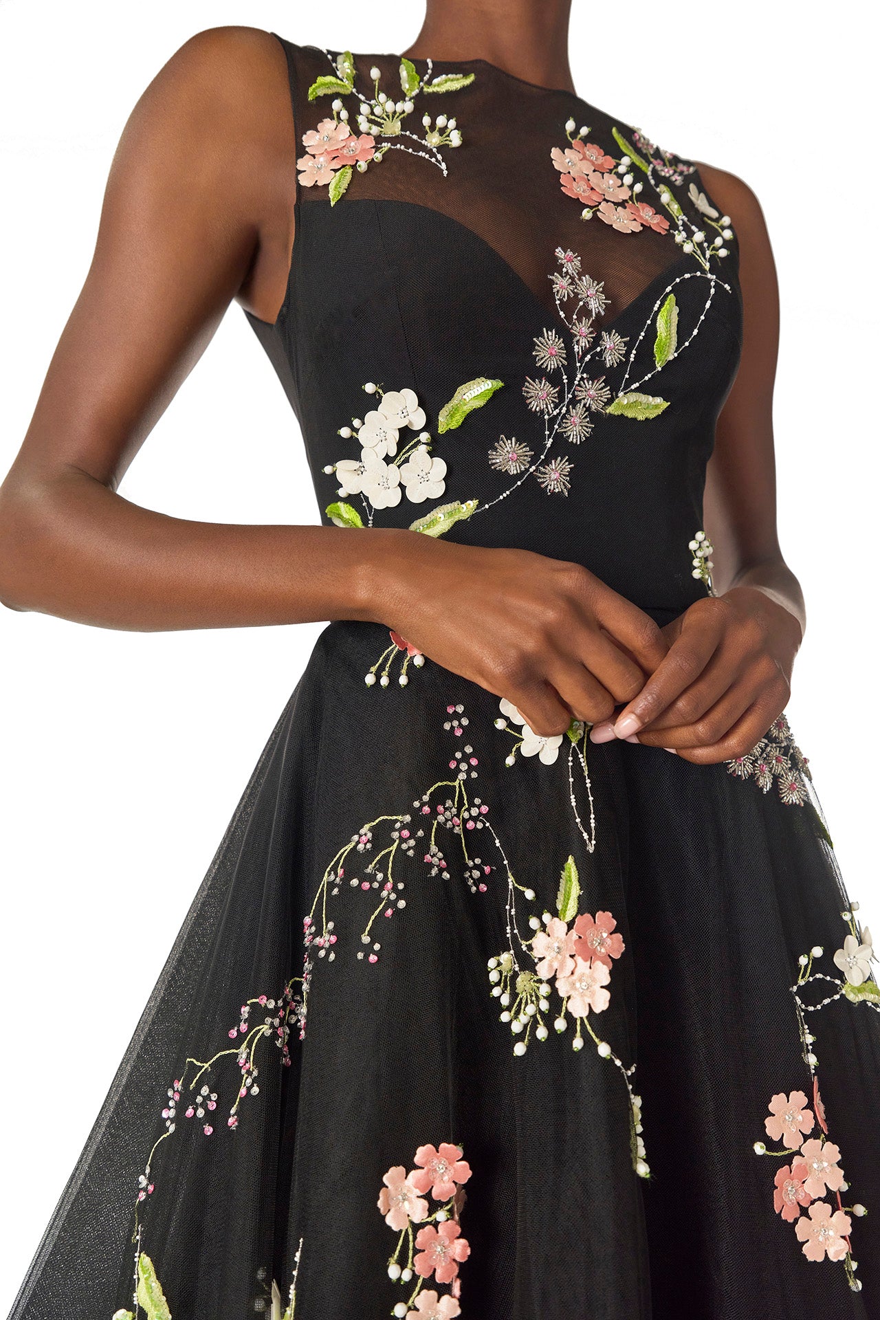 Monique Lhuillier Spring 2025 Sleeveless, noir tulle gown with floral embroidery and slight high-low hem - detail two.