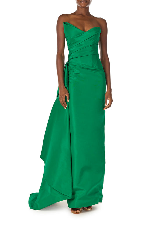 Monique Lhuillier Spring 2025 Strapless column gown with asymmetric draped neckline and sweeping side train in grass green faille fabric - front.