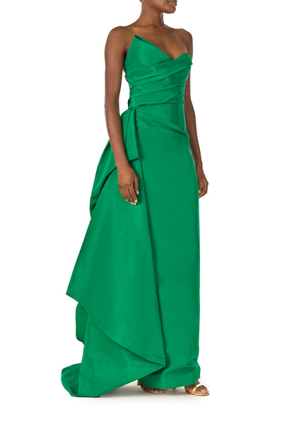 Monique Lhuillier Spring 2025 Strapless column gown with asymmetric draped neckline and sweeping side train in grass green faille fabric - right side.
