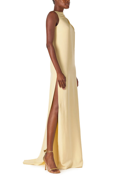 Monique Lhuillier Spring 2025 draped shoulder caftan gown with integral cape and side slit in limoncello yellow - right side.