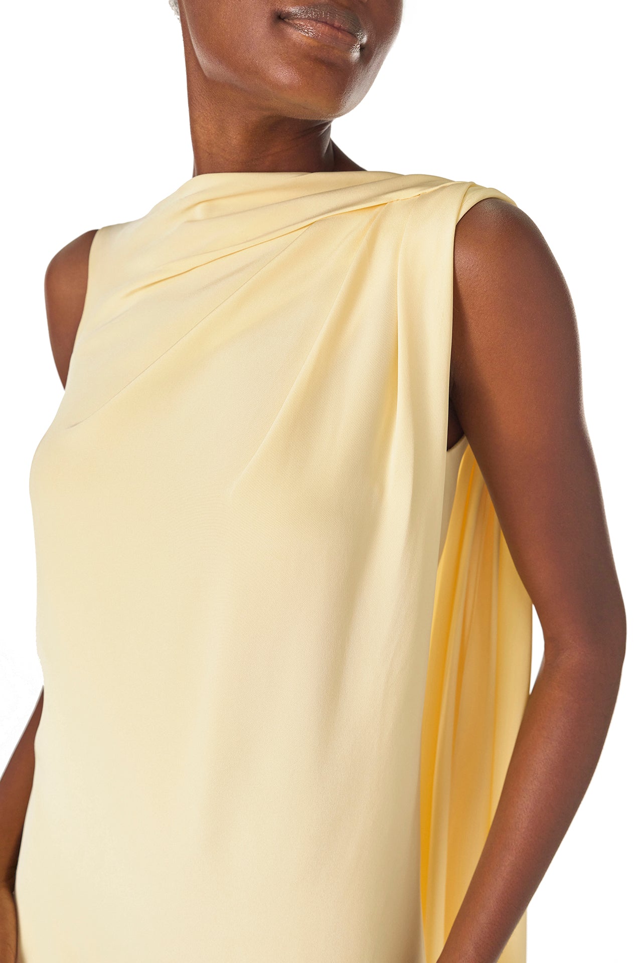 Monique Lhuillier Spring 2025 draped shoulder caftan gown with integral cape and side slit in limoncello yellow - draped detail.