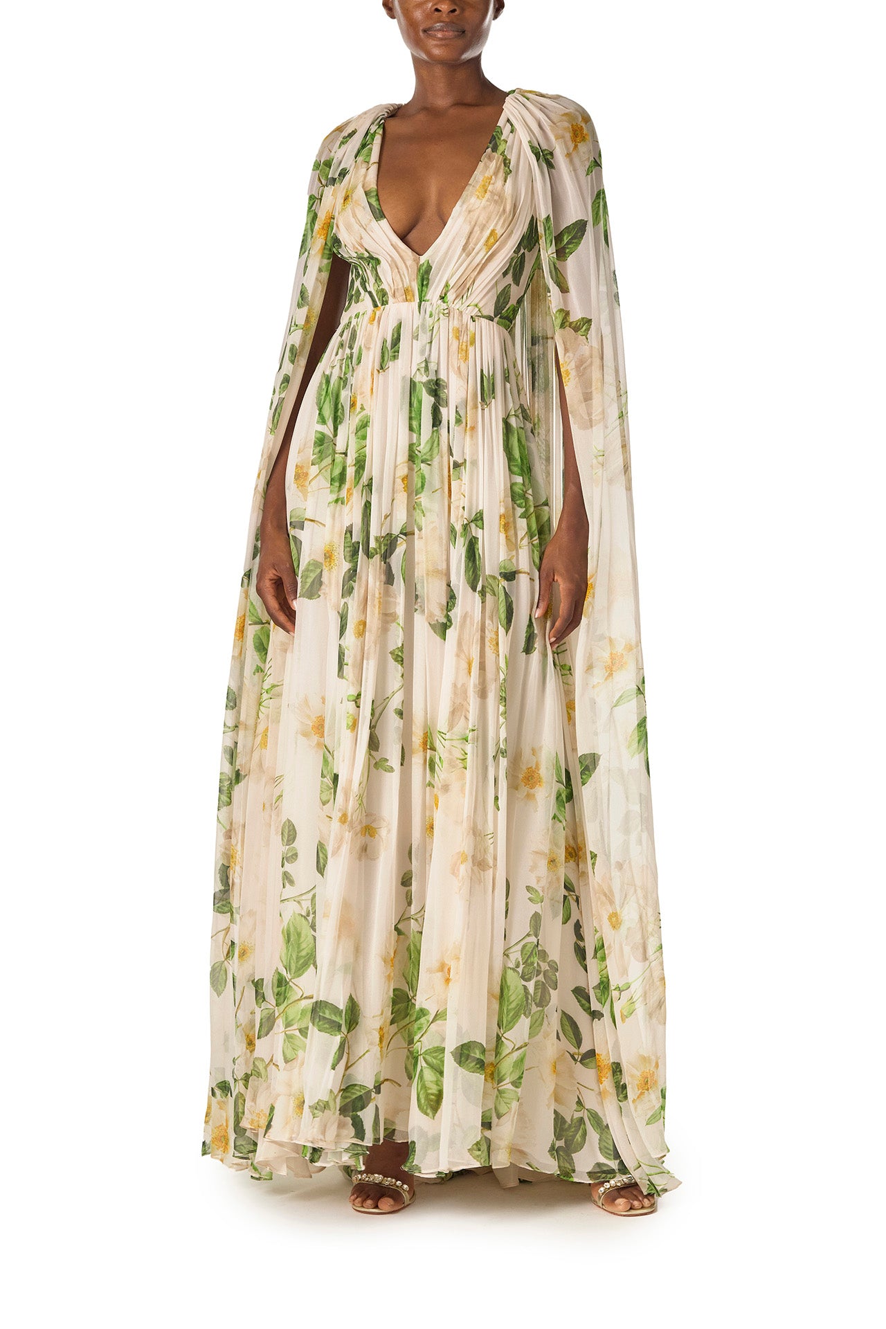 Monique Lhuillier Spring 2025 Draped, v-neck gown in Rose Printed Chiffon with low back and flowing, integral cape - front.