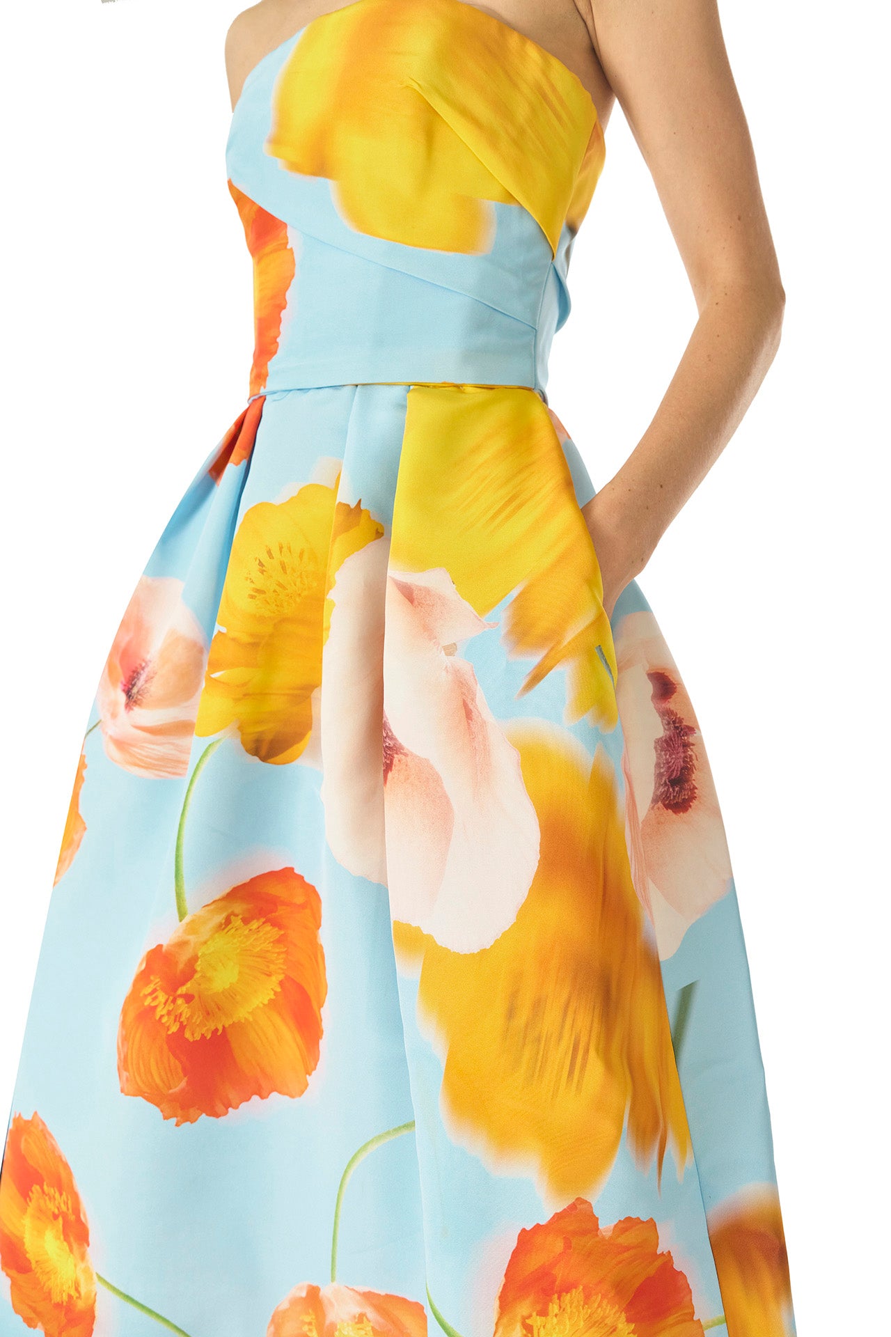 Monique Lhuillier Spring 2025 Strapless tea-length dress with draped bodice and pleated skirt in poppy printed blue faille fabric - fabric and pockets.