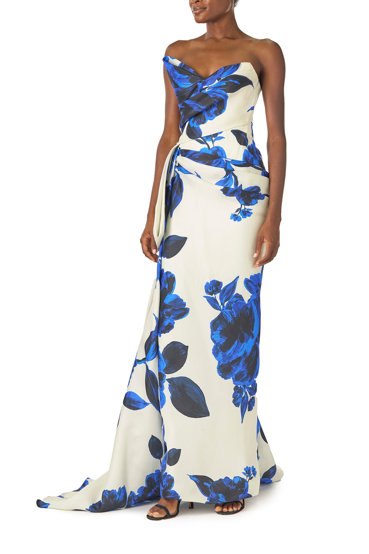 Monique Lhuillier Spring 2025 Strapless, column gown with asymmetric neckline, tufted draping and sweeping side train in Nautical Blue Floral printed gazar - left side.