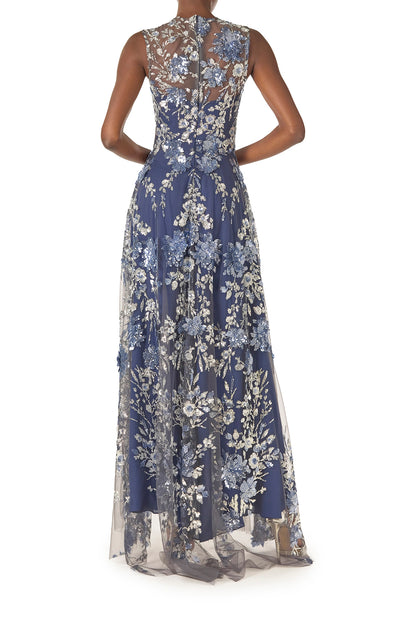 Monique Lhuillier sleeveless, sequin tulle gown with illusion neckline and slight high-low hem in navy multi colors - back.