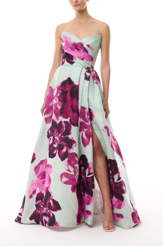 Monique Lhuillier Fall 2025 strapless ballgown with high leg slit and pockets in electric floral printed gazar - front.
