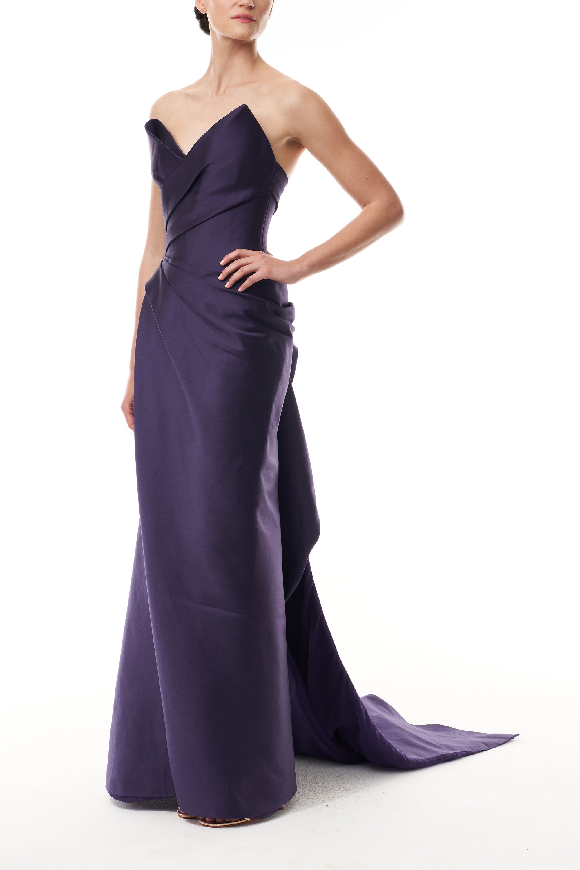 Monique Lhuillier Fall 2025 floor length gown with draped bodice and front leg slit in violet mikado fabric - side.