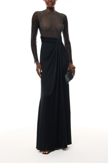 Monique Lhuillier Fall 2025 RTW Noir Long Sleeve Hotfix gown with embellished bodice and front slit - front with Noir Glitter Dasha Minaudiere. 