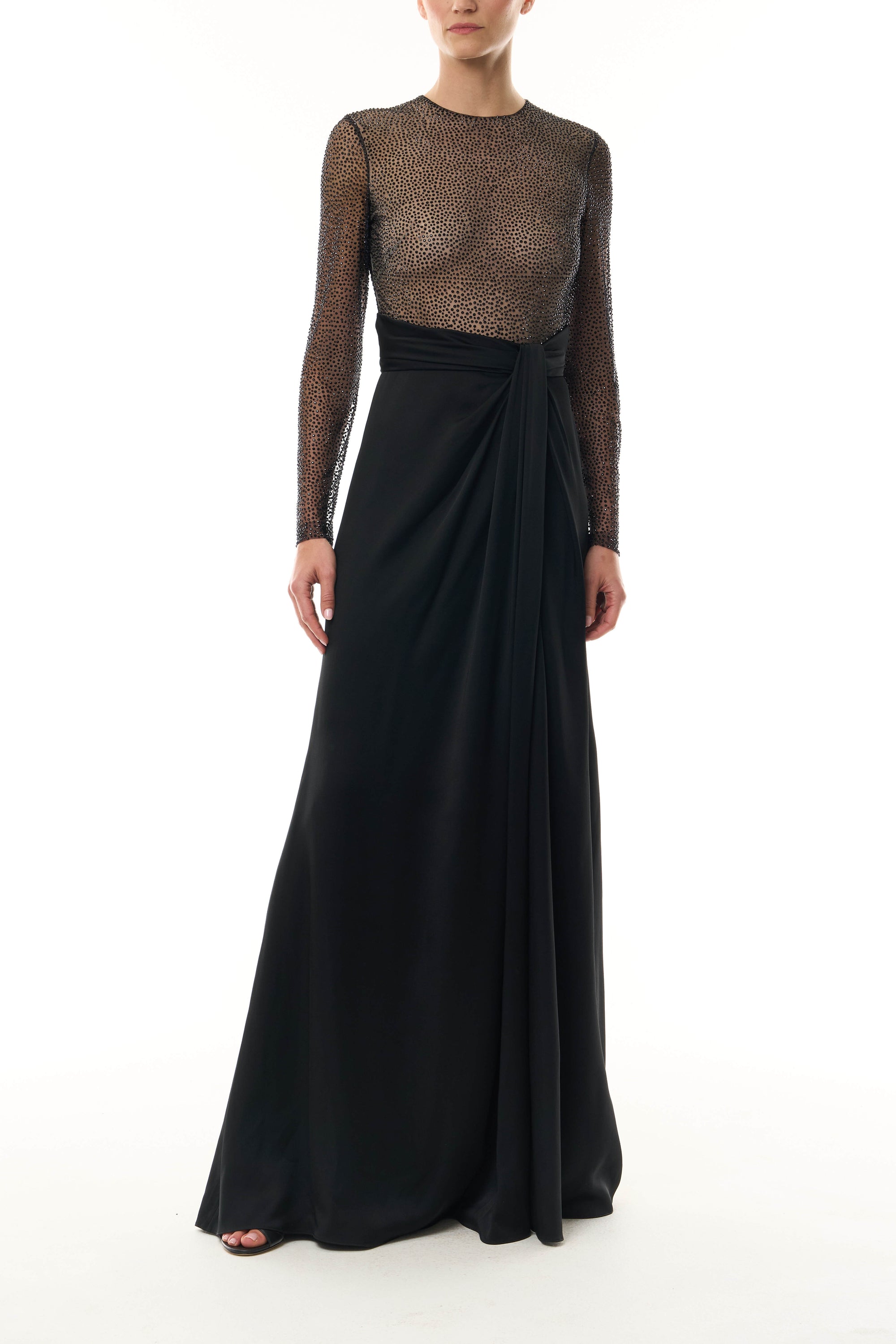 Monique Lhuillier Fall 2025 RTW Noir Long Sleeve Hotfix gown with embellished bodice and front slit - front.