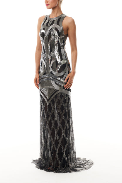 Monique Lhuillier Fall 2025 sleeveless, floor length gown in noir and silver deco embroidery - side.
