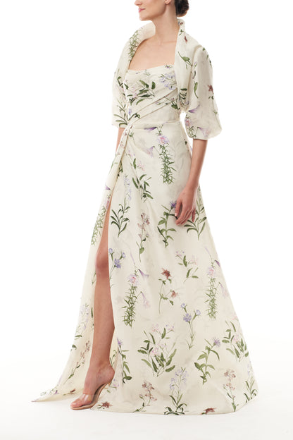 Monique Lhuillier Fall 2025 high neck bolero in floral gazar shown over the matching strapless gown - side.