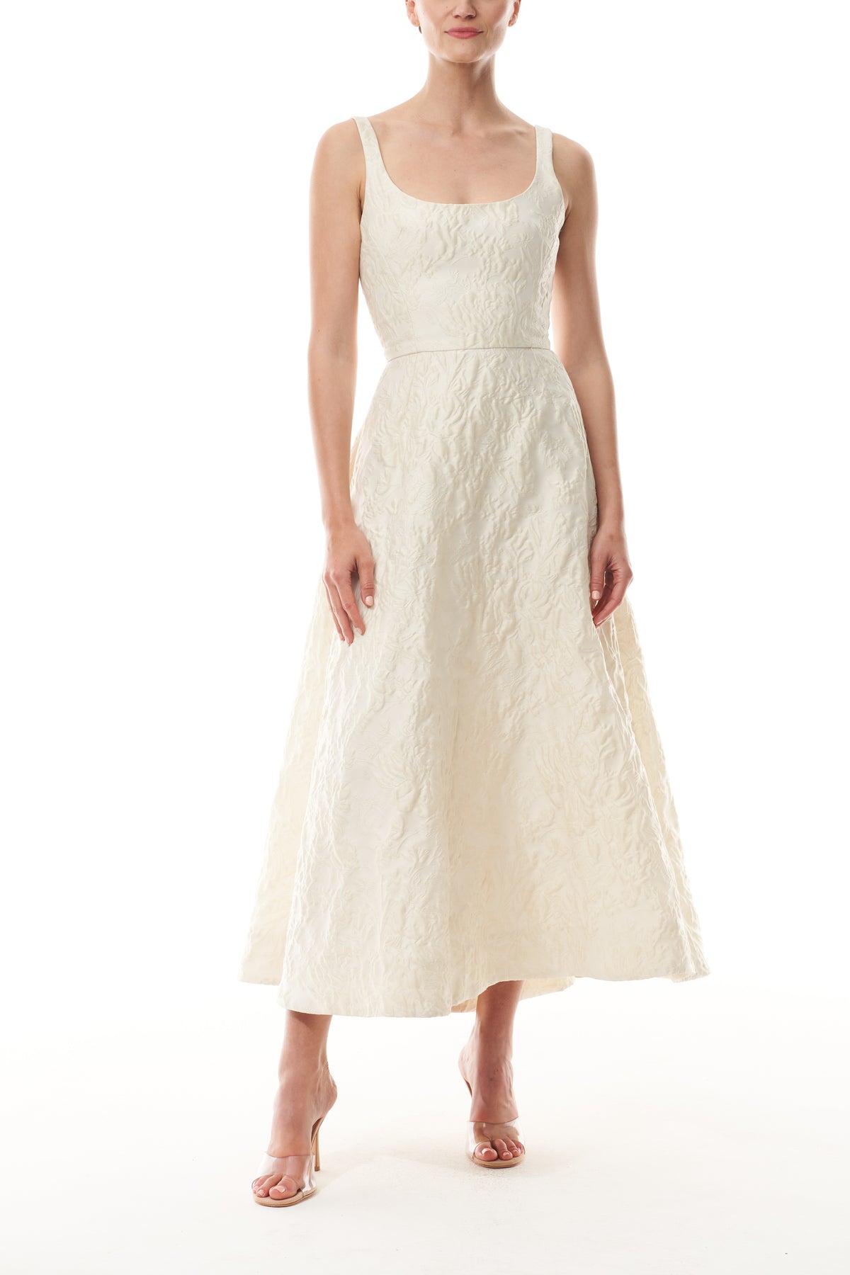 Monique Lhuillier Fall 2025 scoop neck, a-line dress in ivory floral jacquard fabric - front.