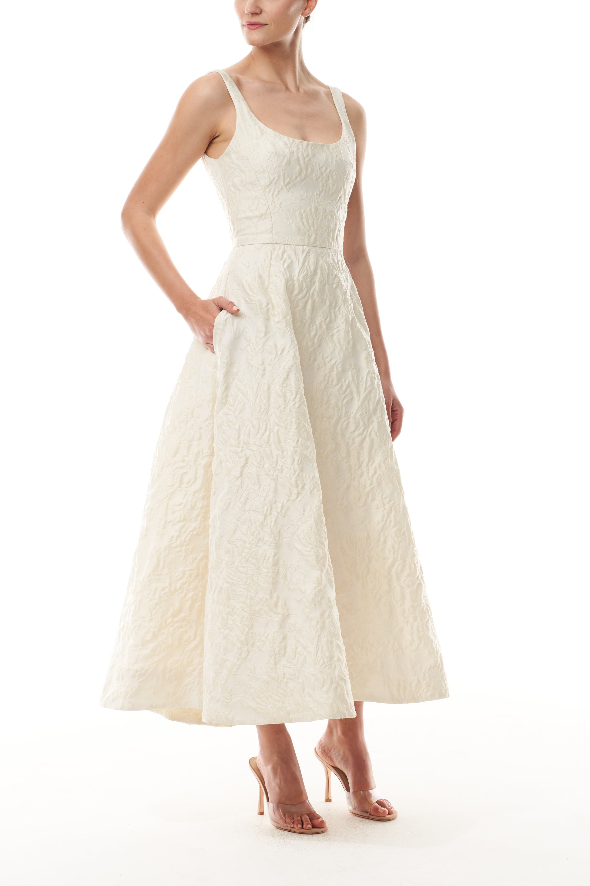 Monique Lhuillier Fall 2025 scoop neck, a-line dress in ivory floral jacquard fabric - side.
