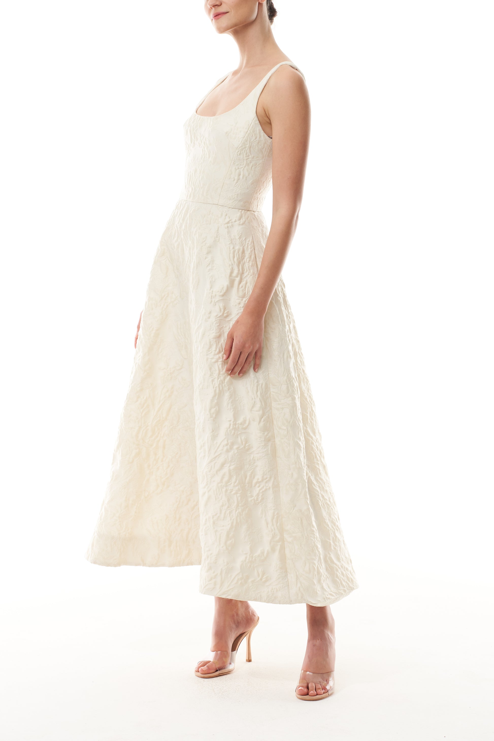 Monique Lhuillier Fall 2025 scoop neck, a-line dress in ivory floral jacquard fabric - side.