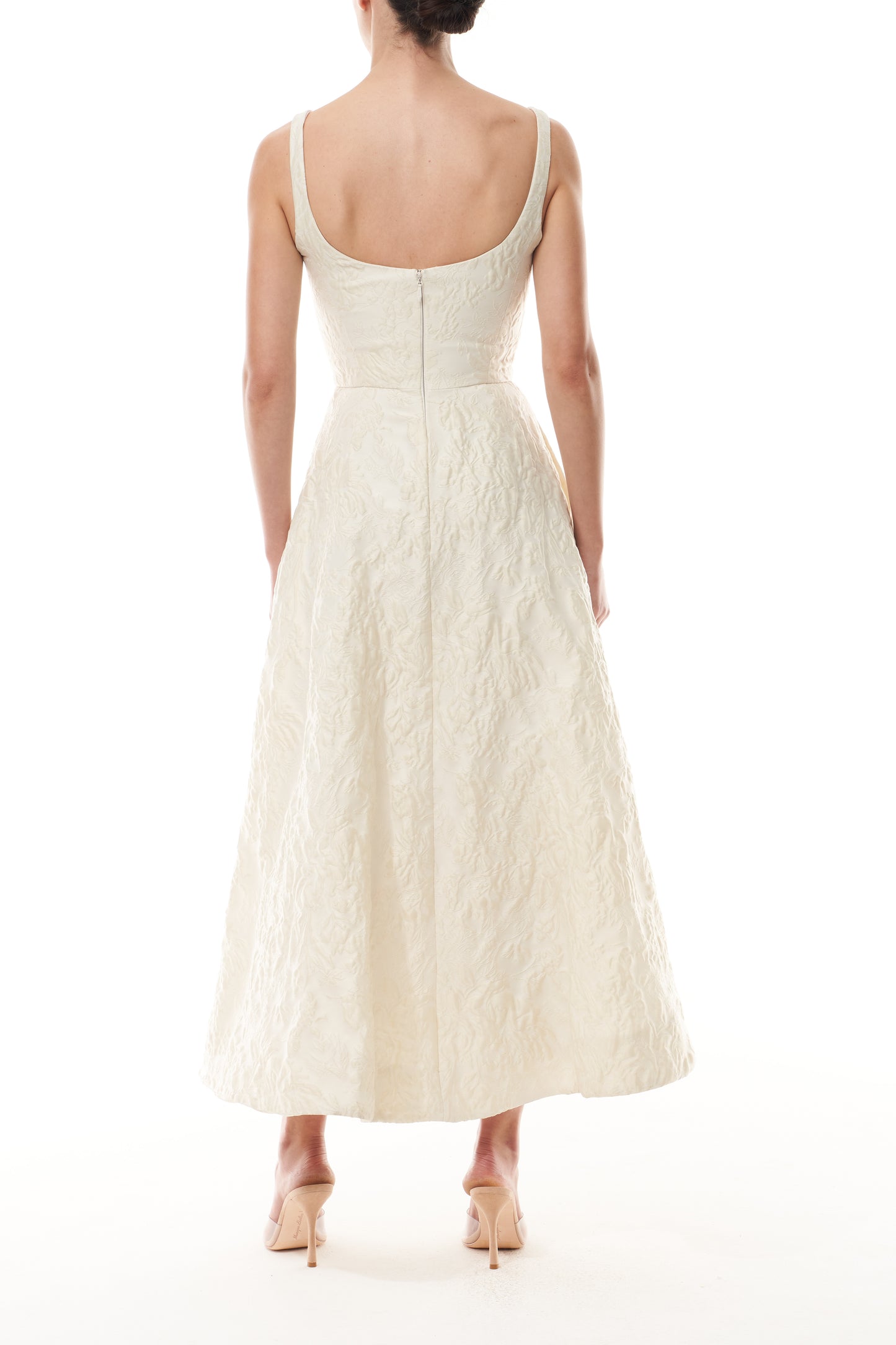 Monique Lhuillier Fall 2025 scoop neck, a-line dress in ivory floral jacquard fabric - back.