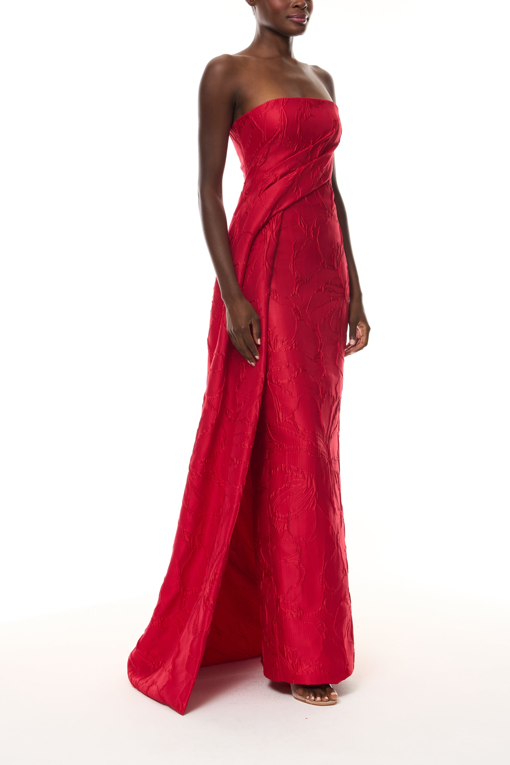 Monique Lhuillier Spring 2026 Poppy Linear Rose Jacquard Strapless Strapless draped column gown with train - side.