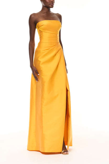 Monique Lhuillier Spring 2026  Mikado Mango strapless corseted draped gown with slit - side.