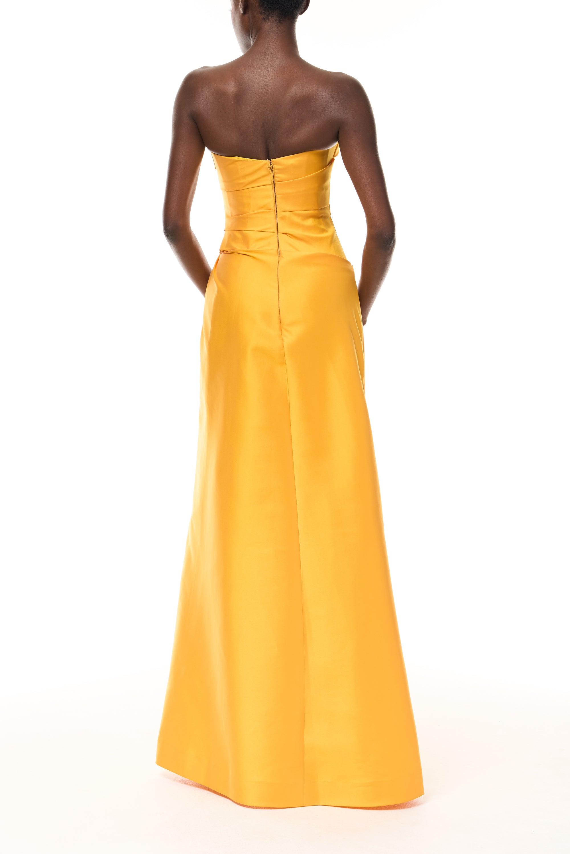 Monique Lhuillier Spring 2026  Mikado Mango strapless corseted draped gown with slit - back.