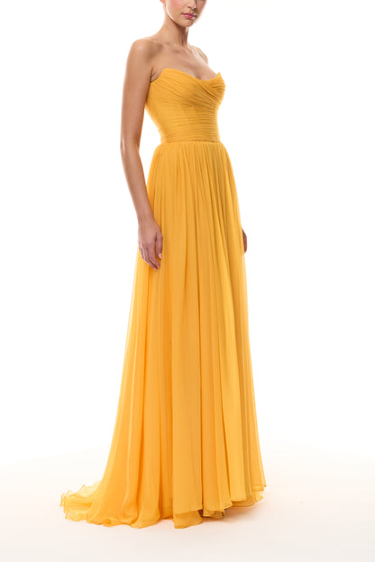 Monique Lhuillier Spring 2026 strapless Mango chiffon draped bodice gown - side.
