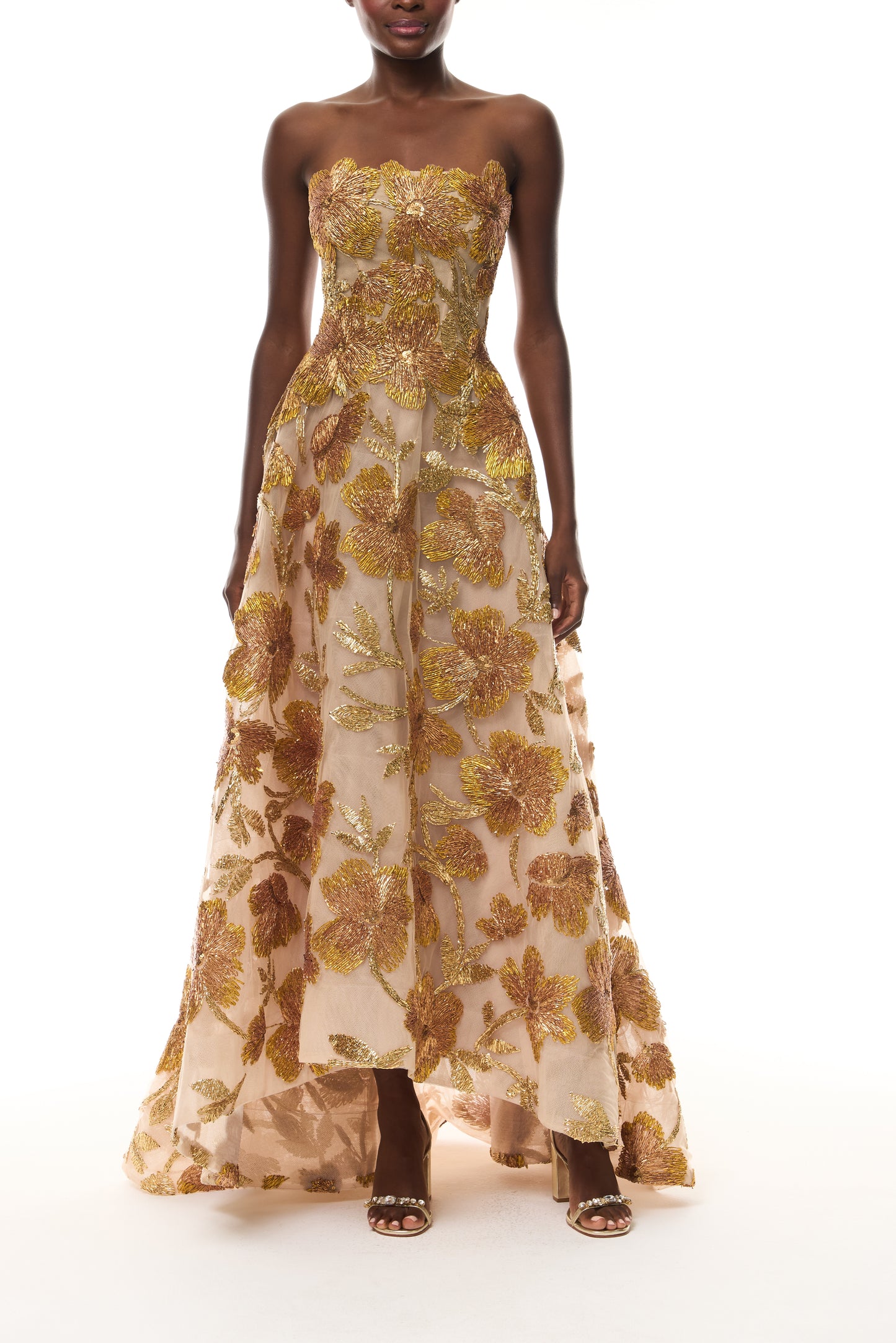 Monique Lhuillier Spring 2026 Gold/Multi Metallic Raffia Floral Embroidered Tulle Strapless ball gown with high-low hem - front.