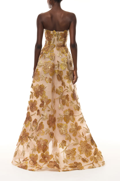 Monique Lhuillier Spring 2026 Gold/Multi Metallic Raffia Floral Embroidered Tulle Strapless ball gown with high-low hem - back.