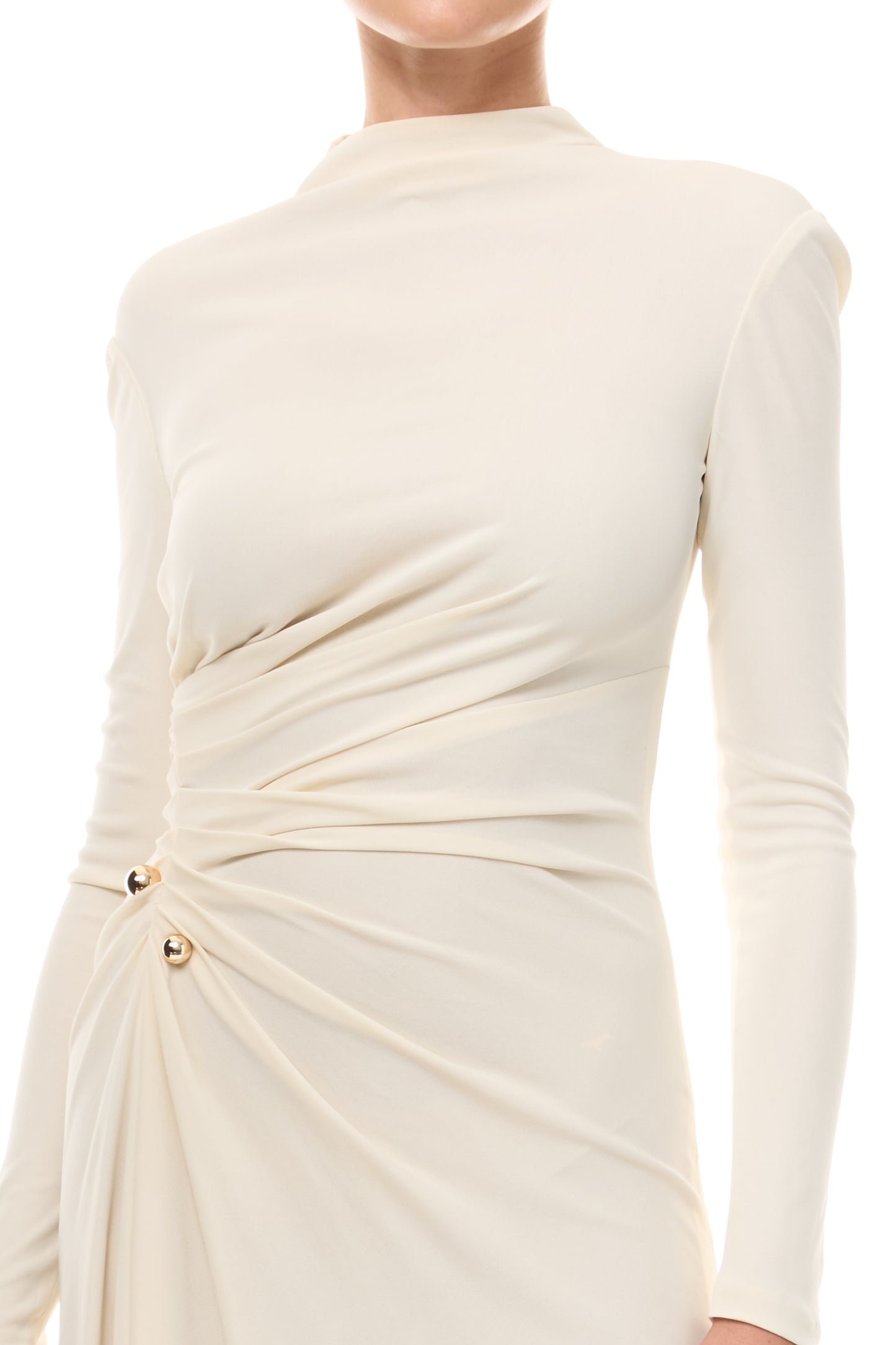 Monique Lhuillier Spring 2026 Ivory crepe jersey high neck long sleeved draped gown with slit and gold ball piercing - fabric.