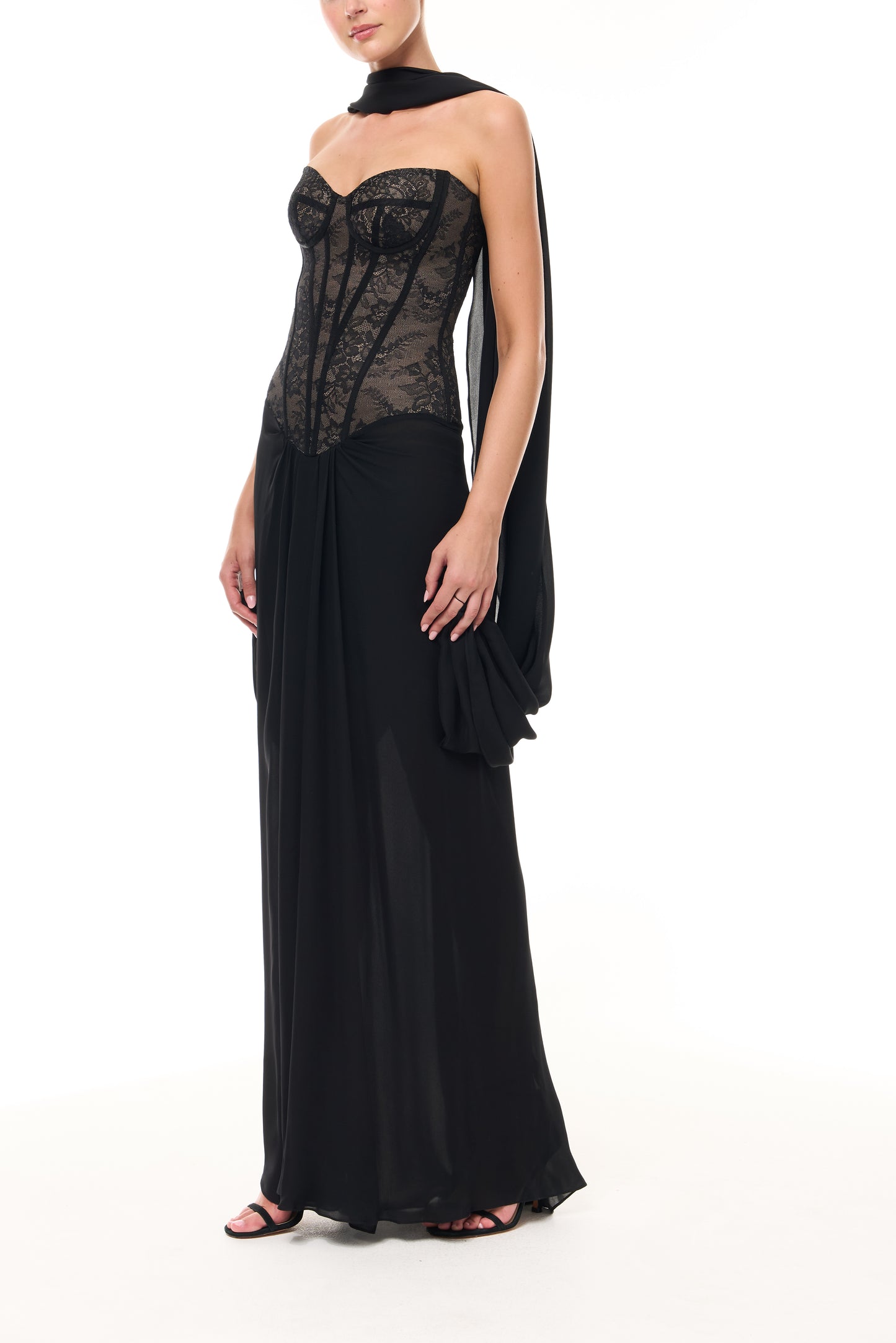 Monique Lhuillier Spring 2026 Noir lace and georgette corseted dropped waist gown with shawl - side.